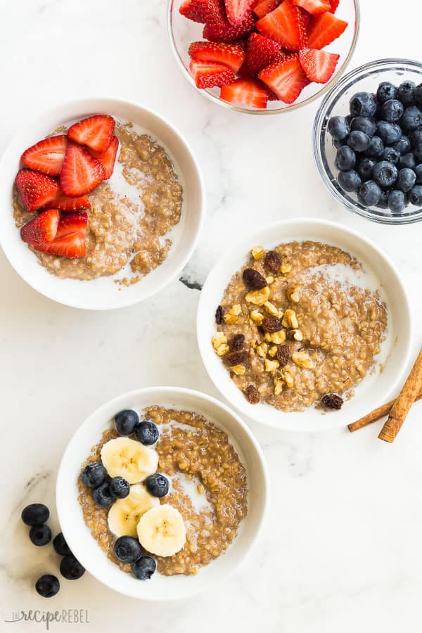 instant pot oatmeal 3 bowls with strawberries blueberries bananas nuts and raisins