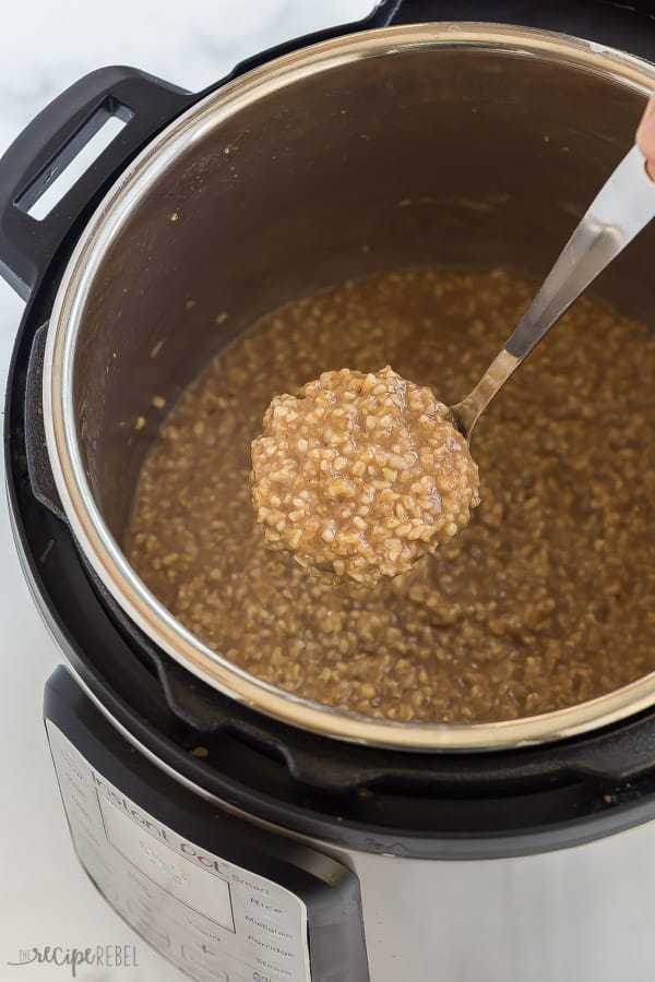 instant pot steel cut oats in pressure cooker with scoop coming out