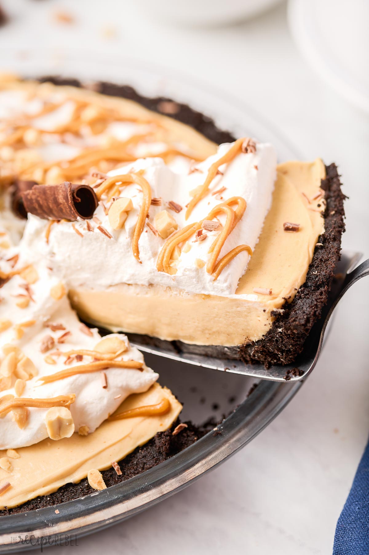 close up image of slice of peanut butter pie coming out of whole