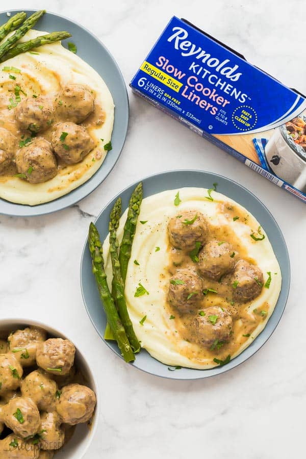 slow cooker swedish meatballs plated with bowl of meatballs and reynolds slow cooker liners