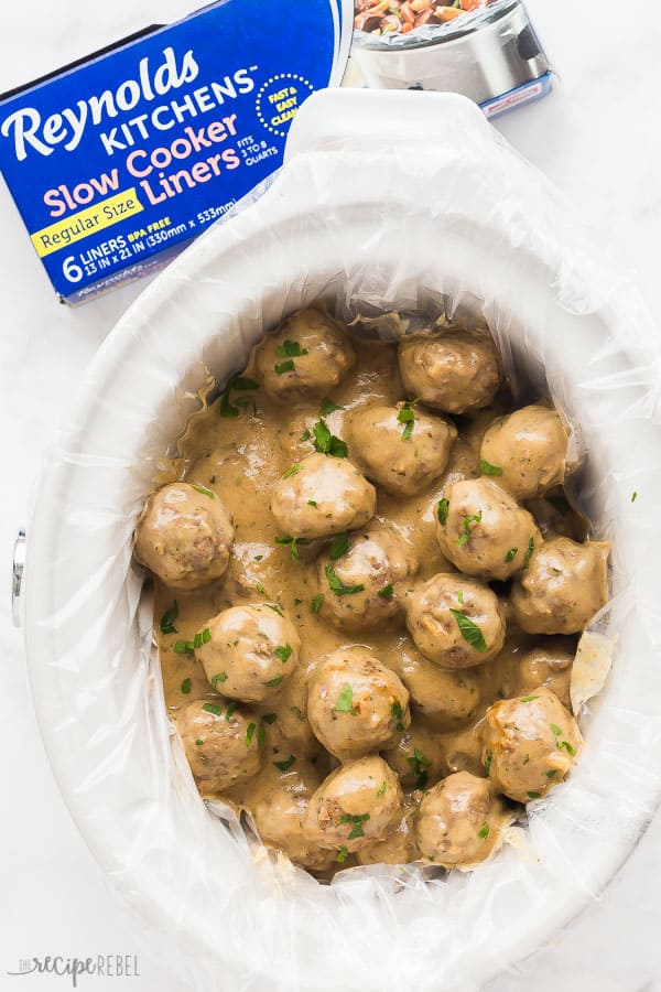 crockpot swedish meatballs overhead with slow cooker liner on white background