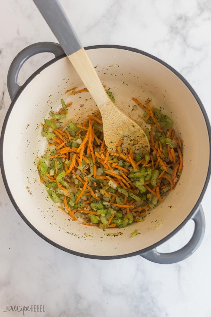 sauteeing vegetables in large pot for chicken gnocchi soup