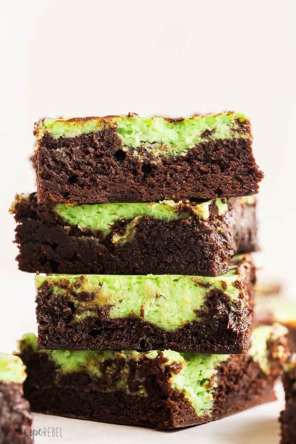 mint cream cheese brownies stack of pieces against white background