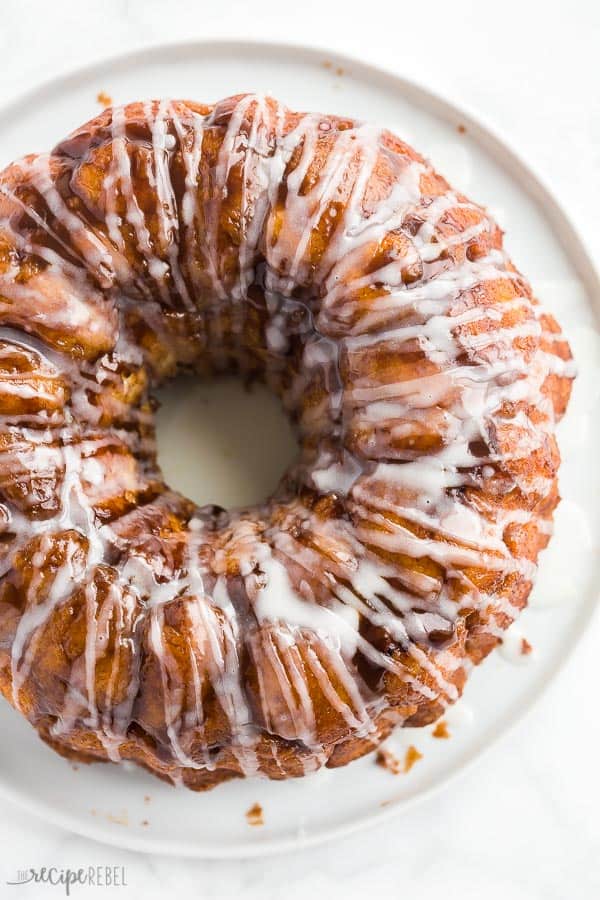 glazed monkey bread overhead on white plate on white background