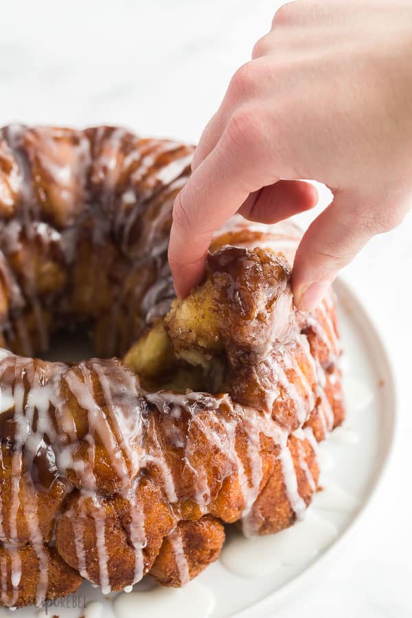 monkey bread piece being removed by hand