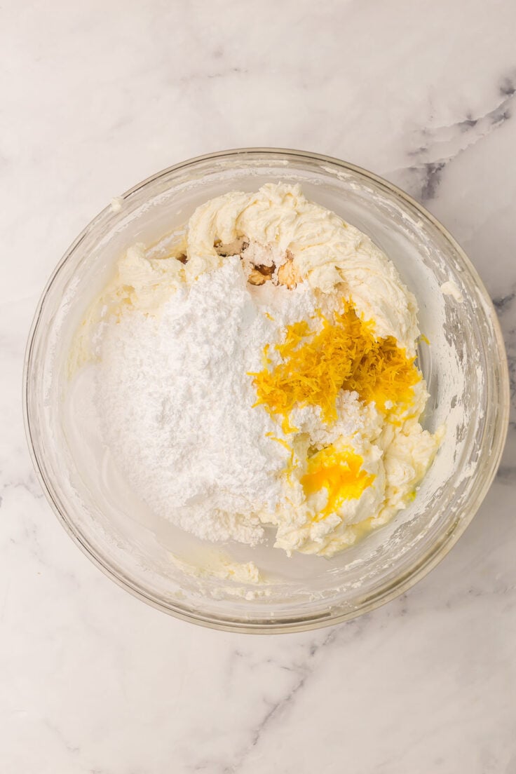 cream cheese, sugar, lemon zest and vanilla in large glass bowl