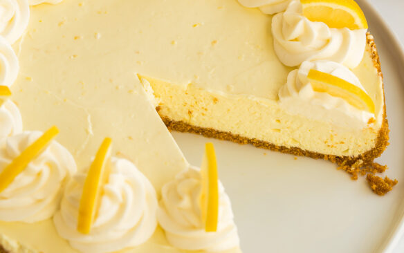 featured image of no bake lemon cheesecake with slice missing