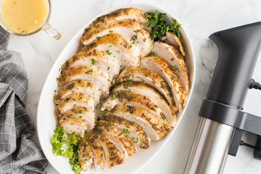 sous vide turkey on white serving plate with anova sous vide pro