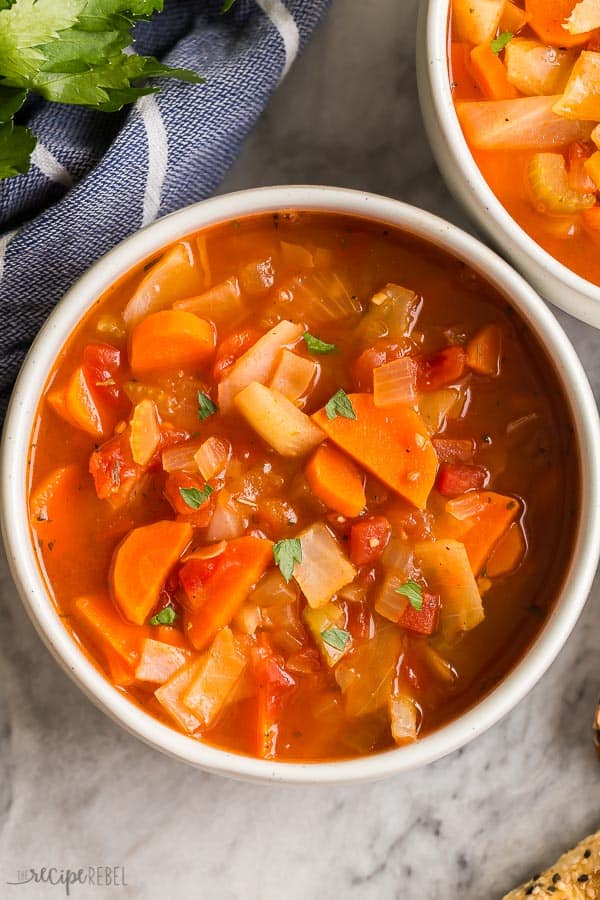 cabbage soup in bowl close up and overhead on marble