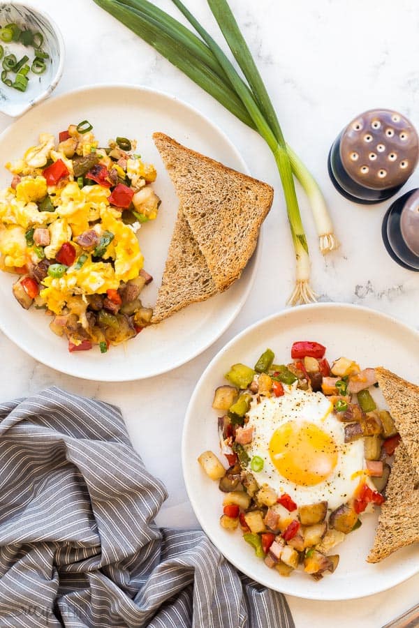 breakfast skillet two ways on white plates on marble background