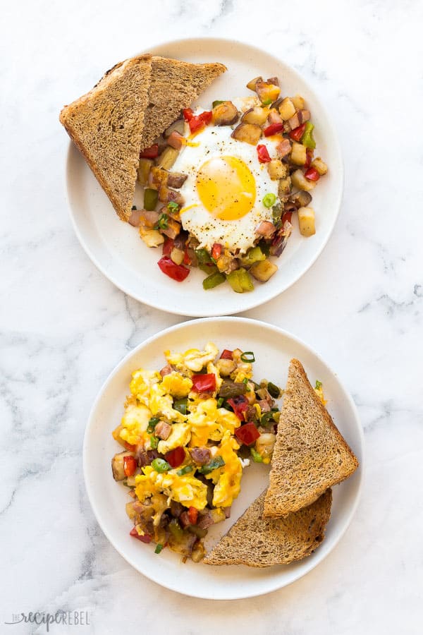 breakfast skillet eggs two ways with toast on white plates on white marble background