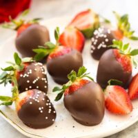 chocolate covered strawberries on plate