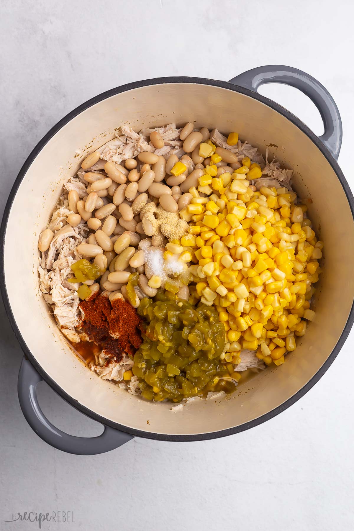 beans seasonings corn and green chiles added to pot with chicken breasts.