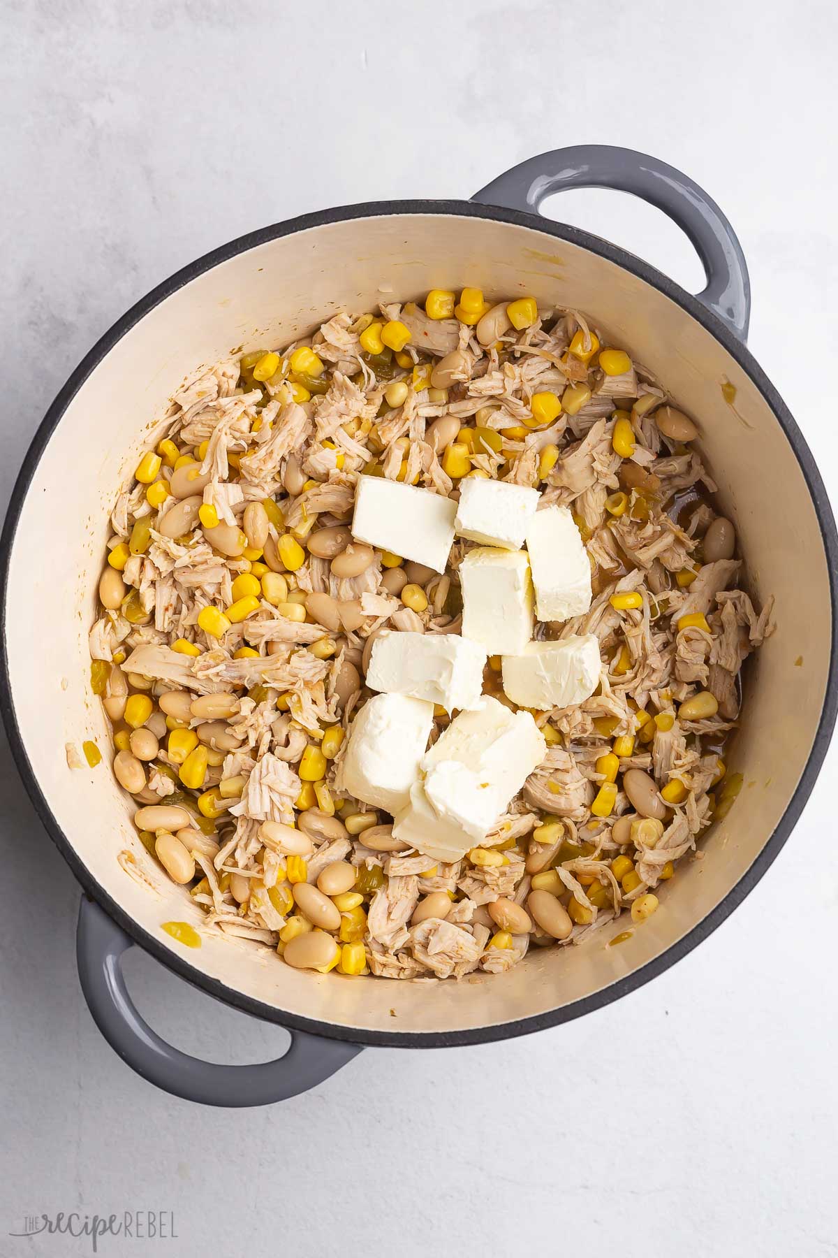 cream cheese added to pot with chili ingredients.