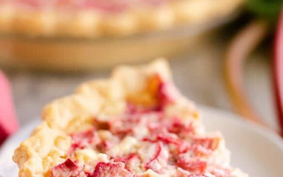 A slice of rhubarb custard pie on a plate.