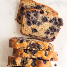 blueberry banana bread overhead with two slices cut