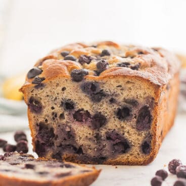 blueberry banana bread with one slice cut close up