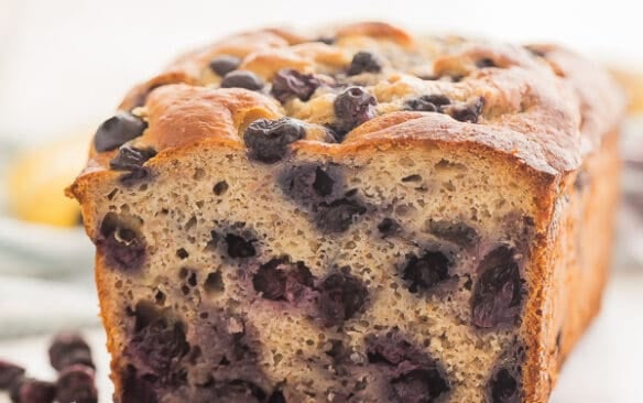 blueberry banana bread with one slice cut close up