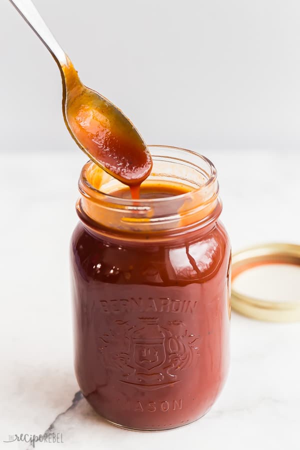 homemade barbecue sauce drizzled from spoon