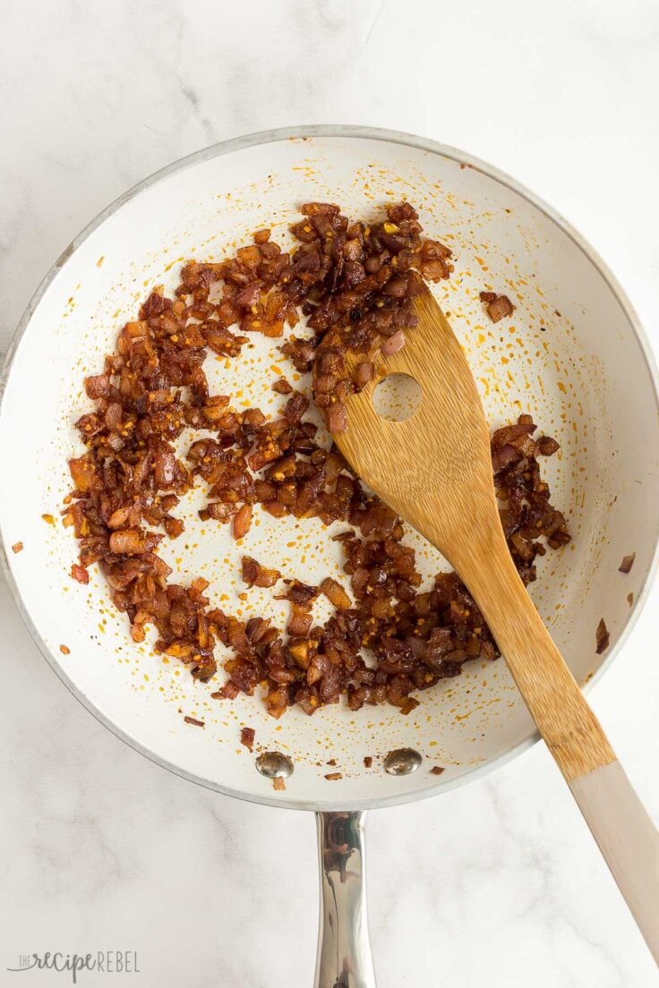 add spices to cooked onions in pan