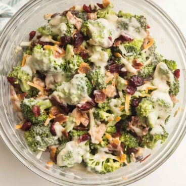 broccoli salad recipe with bacon cranberries cheese and homemade dressing.