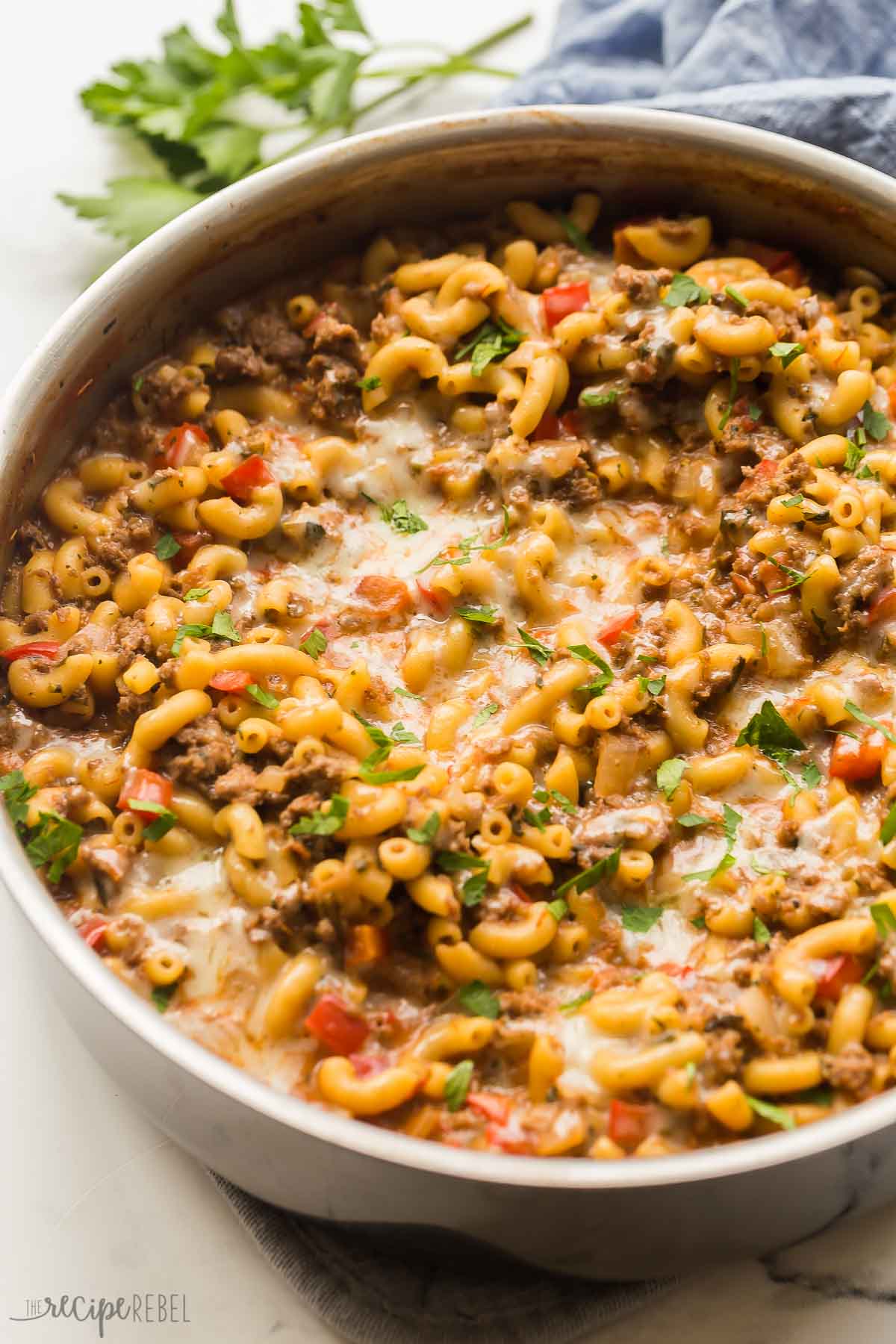 close up image of homemade hamburger helper recipe in stainless skillet.