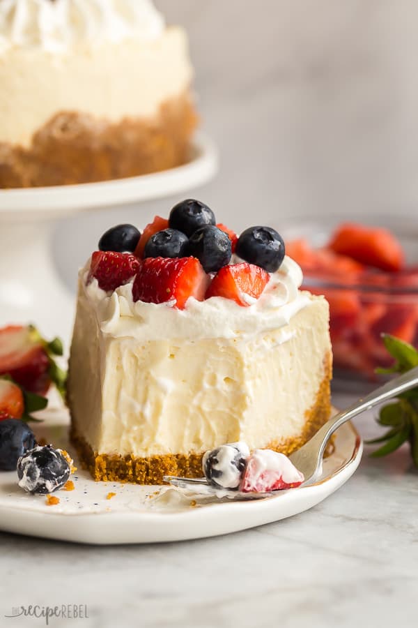 instant pot cheesecake slice on white plate with fork on the side