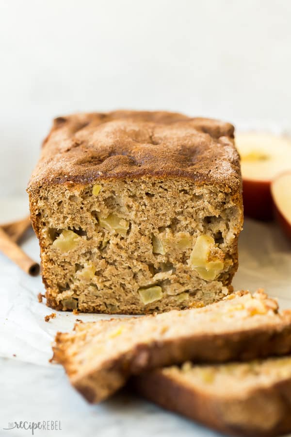 apple bread on marble background with two slices cut