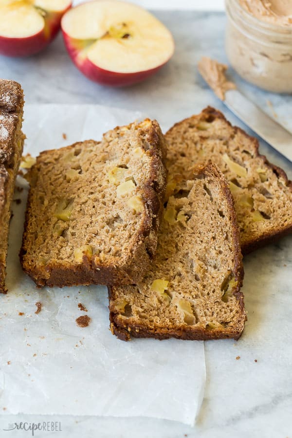 three slices cut from apple bread laying on parchment paper