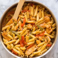 overhead image of chicken fajita pasta in stainless steel skillet