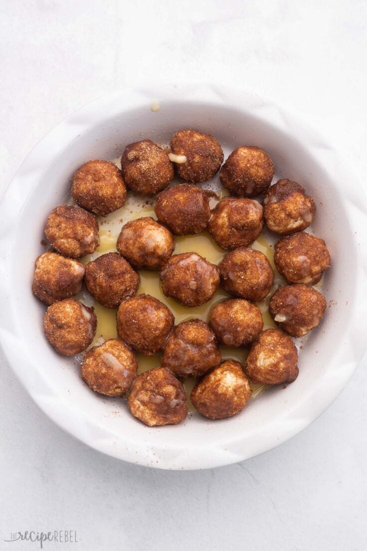 cinnamon roll bites in pie plate before baking.