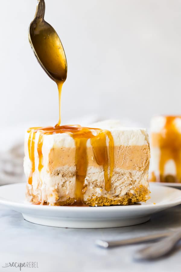 piece of frozen pumpkin dessert with a drizzle of butterscotch syrup