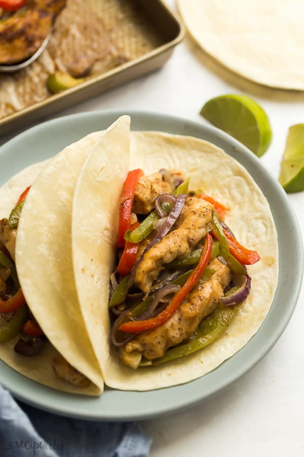 close up of chicken fajitas on flour tortilla