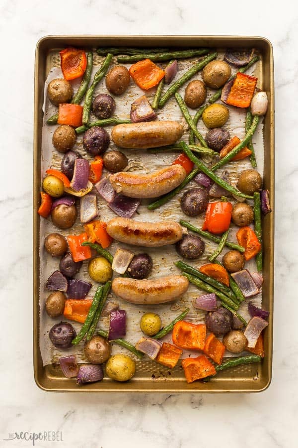 sheet pan sausage and potatoes with red pepper green beans and red onion