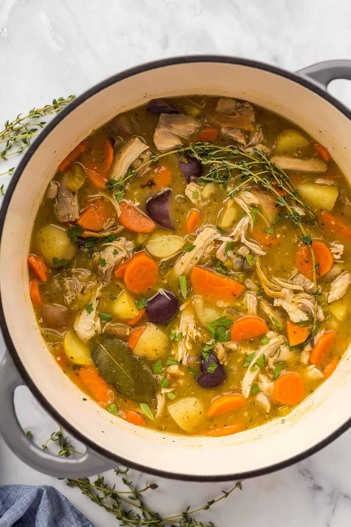 overhead image of chicken stew in dutch oven.