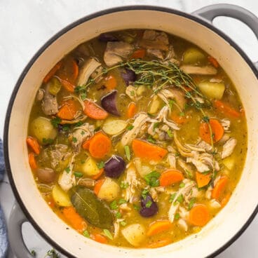 overhead image of chicken stew in grey dutch oven