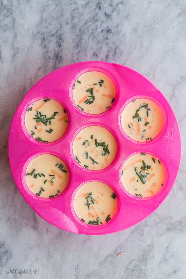 uncooked egg bites in pink silicone egg bite mold