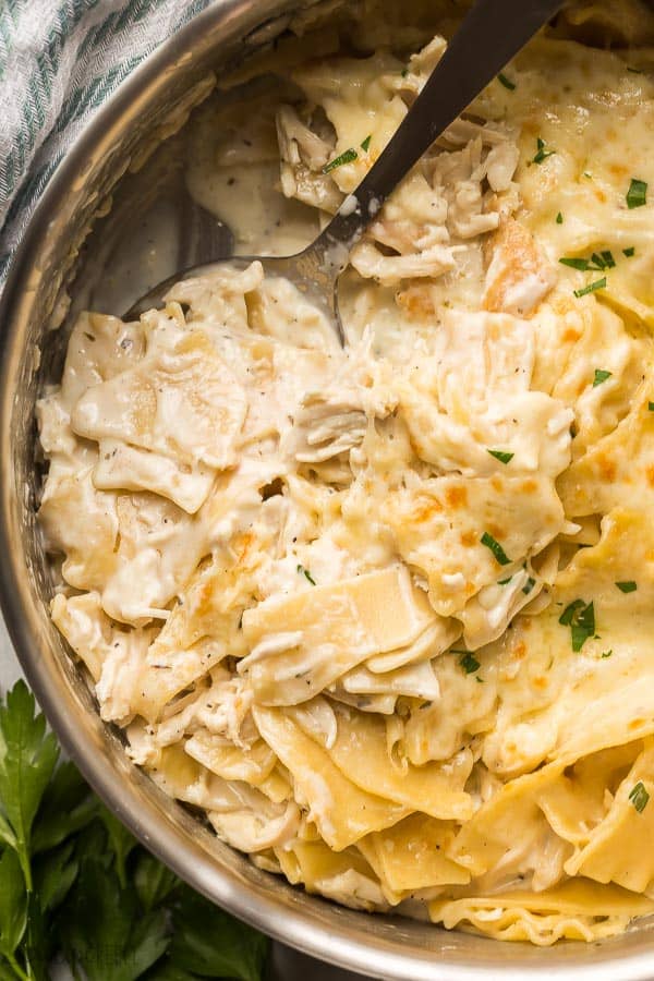 close up image of white chicken lasagna in skillet