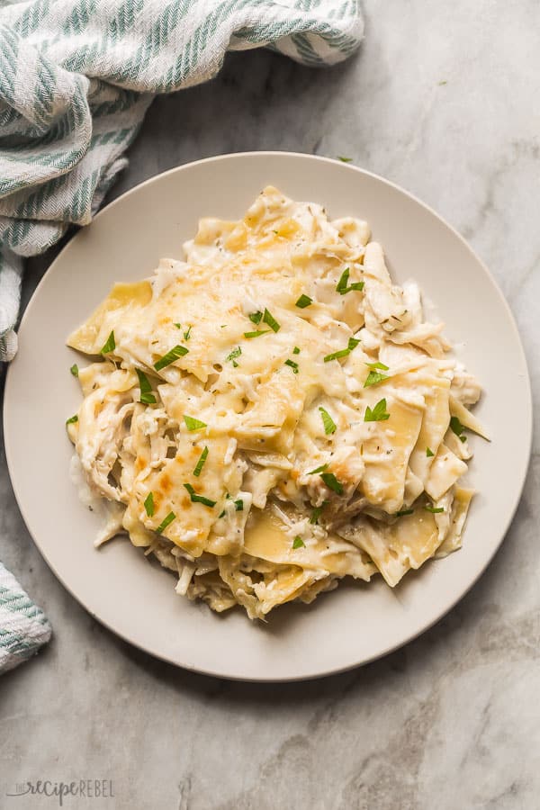 overhead image of white chicken lasagna on grey plate