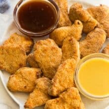 close up image of air fryer turkey nuggets with two dipping sauces