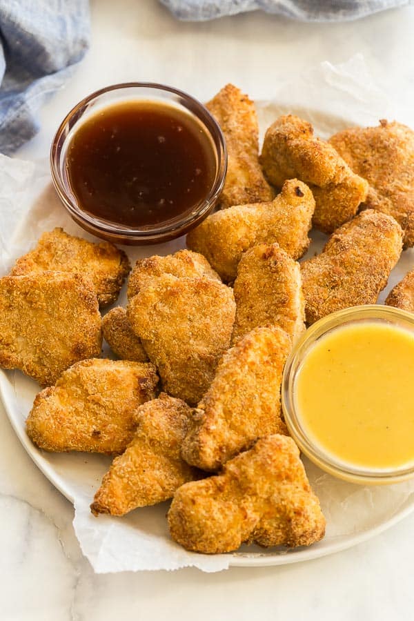 close up image of air fryer turkey nuggets with two dipping sauces