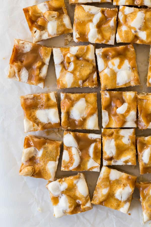 overhead image of caramel nut bars on wax paper