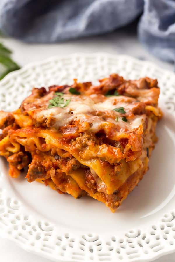 piece of slow cooker lasagna on white plate