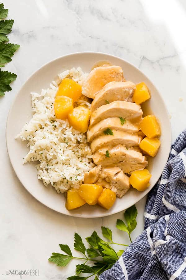 overhead image of plate of rice with sliced pineapple chicken