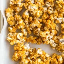 close up image of caramel corn on pan