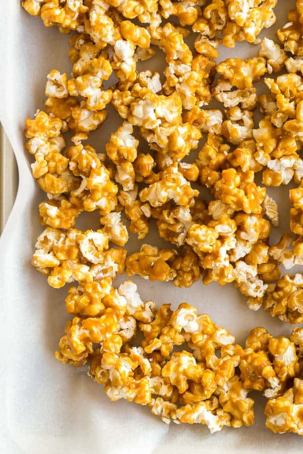 close up image of caramel corn on pan