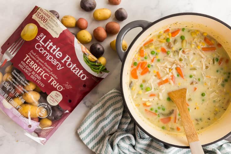 overhead image of chicken pot pie soup and bag of Little potatoes