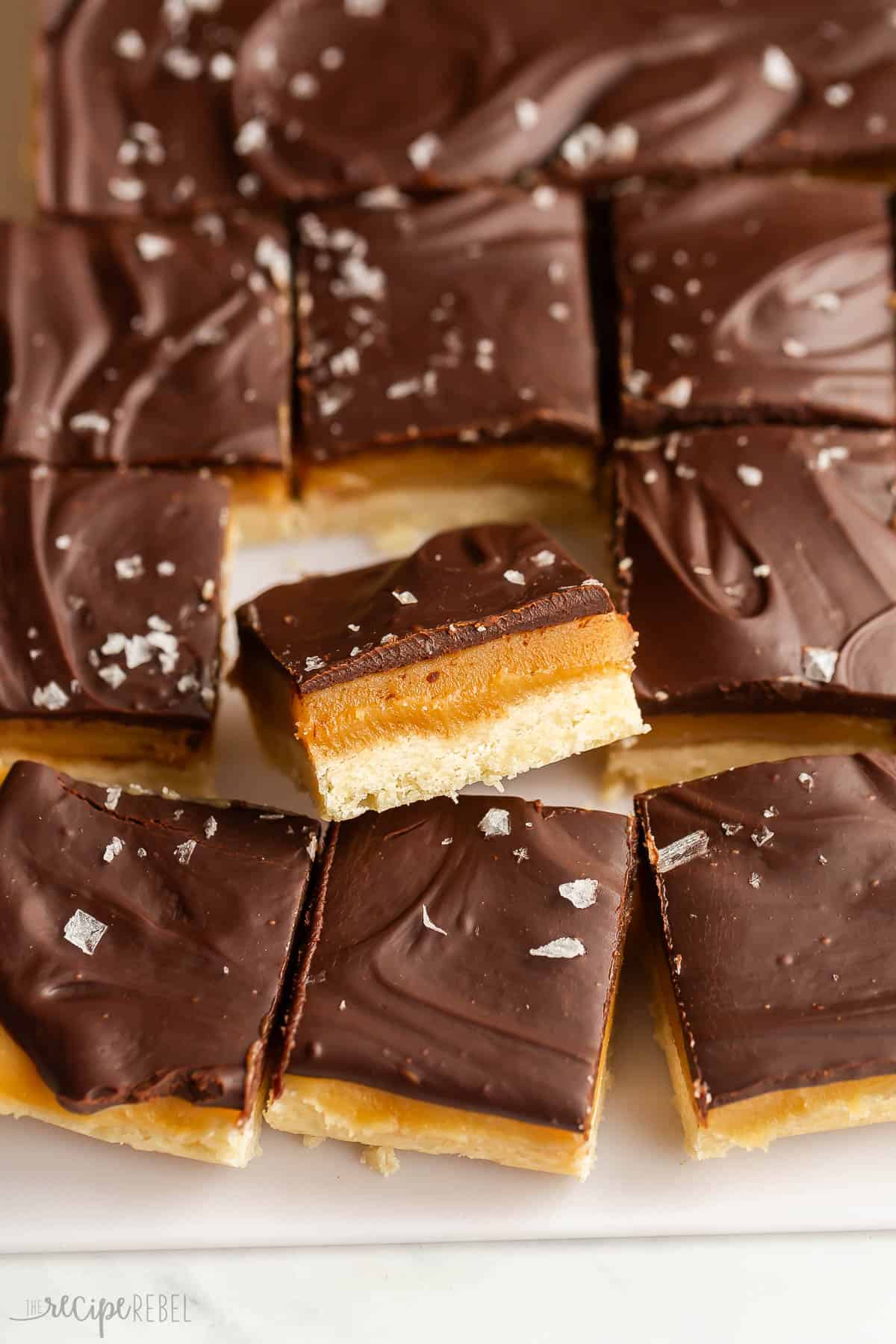 millionaire shortbread bars cut with one propped up.