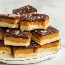 square image of stack of chocolate caramel shortbread.