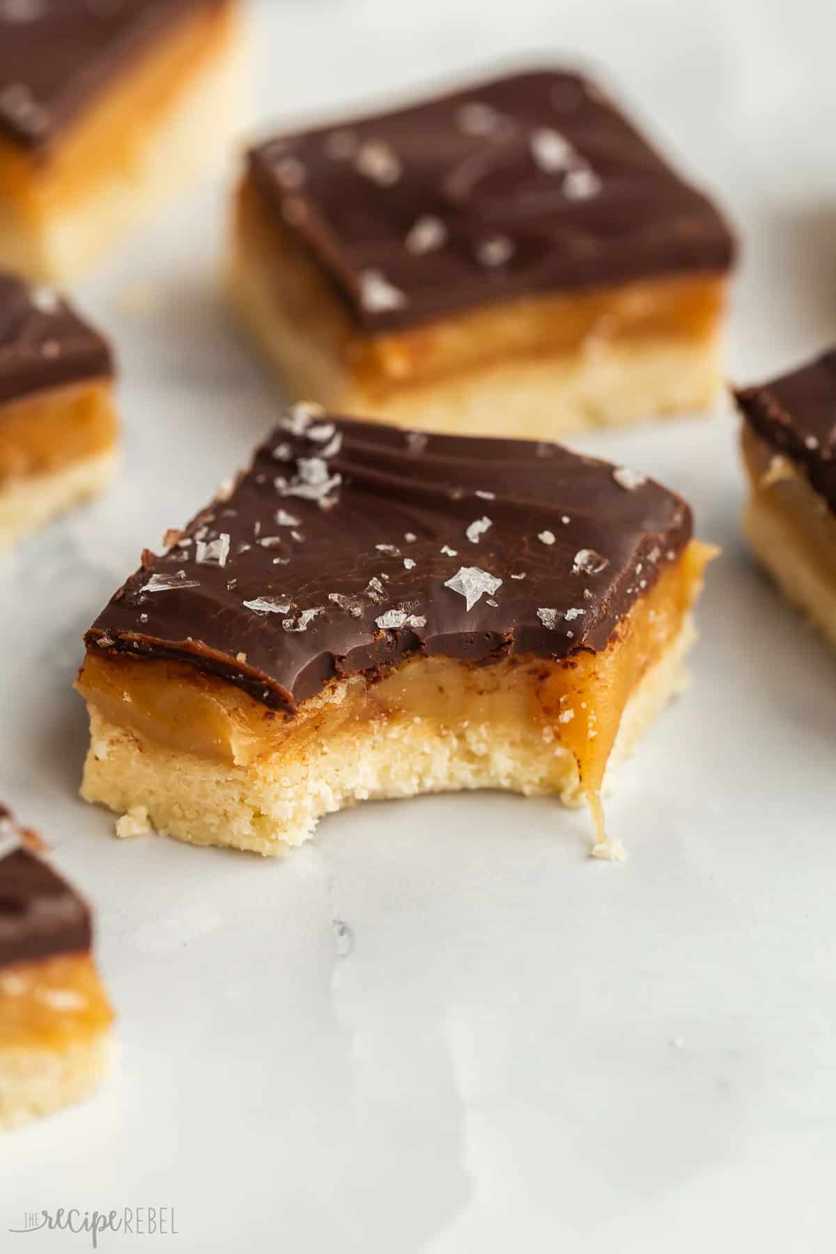 single piece of millionaire shortbread with bite taken.